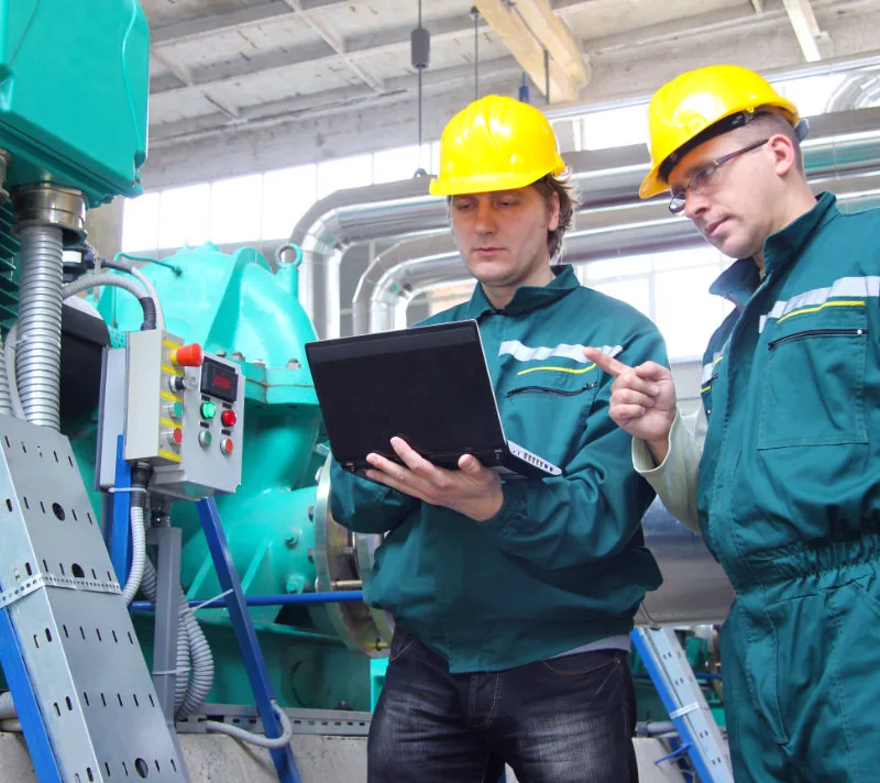 Verification team reviewing operational data on site